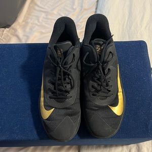 Nike gold and black sneakers